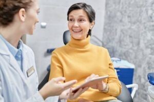Woman consulting with dentist