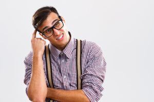 Man in glasses looking puzzled