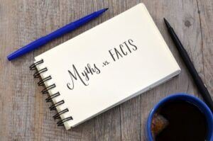 Notebook with words Myths vs Facts written on it