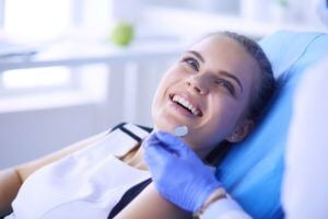 Smiling woman in dentist chair
